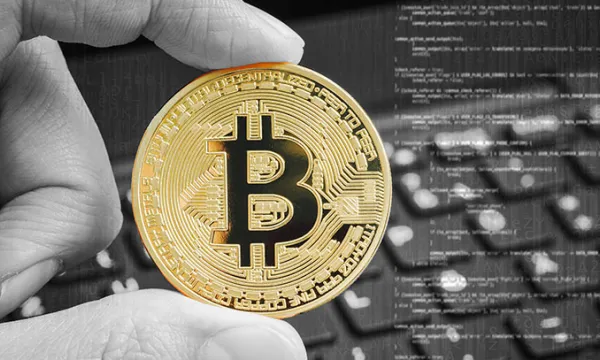bitcoin-moneda-teclado-manobig-1509241603.jpg